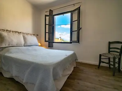 Un ou plusieurs lits dans un hébergement de l'établissement Petit appartement à proximité de St Florent