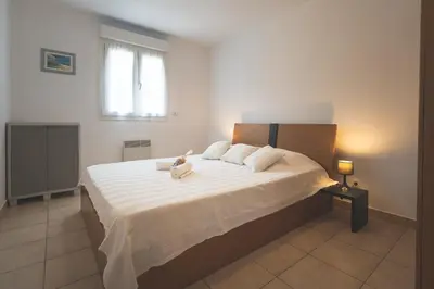 Un ou plusieurs lits dans un hébergement de l'établissement Maison à Cervione Prunete jardin piscine accès direct plage