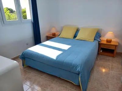 Un ou plusieurs lits dans un hébergement de l'établissement Maison individuelle avec vue sur mer - Les Lauriers