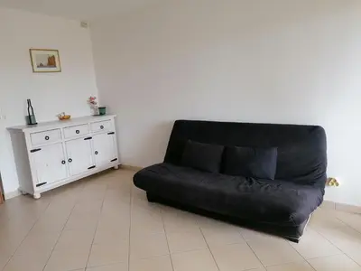 Coin salon dans l'établissement Appartement Résidence Les Eucalyptus