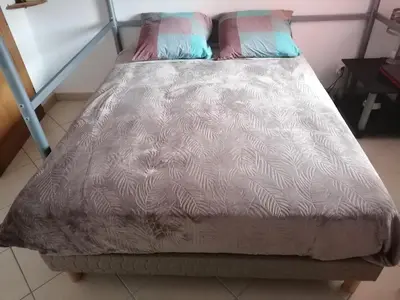 Un ou plusieurs lits dans un hébergement de l'établissement Appartement Résidence Les Eucalyptus