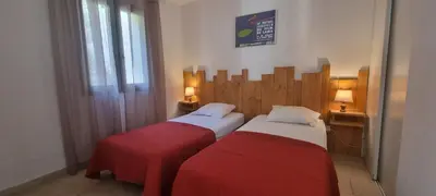 Un ou plusieurs lits dans un hébergement de l'établissement Vos vacances à Lama France Corse