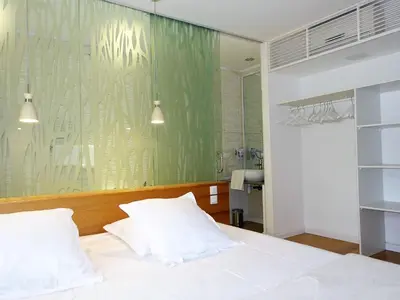 Un ou plusieurs lits dans un hébergement de l'établissement Holiday Home Villa en bois by Interhome