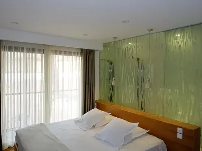 Un ou plusieurs lits dans un hébergement de l'établissement Holiday Home Villa en bois by Interhome