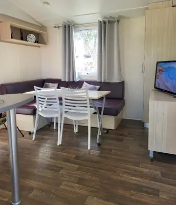 Télévision ou salle de divertissement dans l'établissement Piana