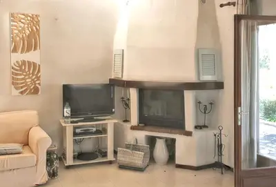 Télévision ou salle de divertissement dans l'établissement Maison Vue Mer à Lumio avec Terrasse et Jardin Clos