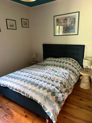 Un ou plusieurs lits dans un hébergement de l'établissement Maison 9 couchages avec piscine et jardin au calme