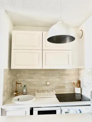 Cuisine ou kitchenette dans l'établissement Le Cocon de Lilie