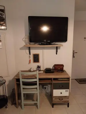Télévision ou salle de divertissement dans l'établissement Les villas de Mélody