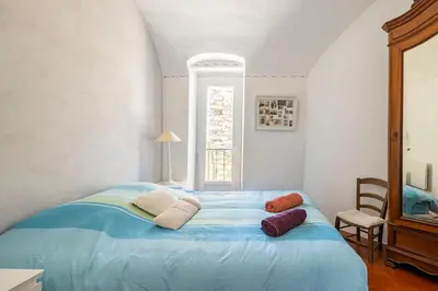 Un ou plusieurs lits dans un hébergement de l'établissement La Maison de B