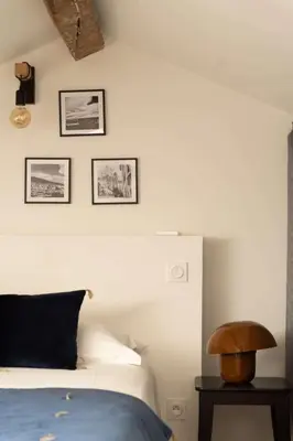 Un ou plusieurs lits dans un hébergement de l'établissement Vatta appartement centre ville avec roof top bain à remous et vue panoramique