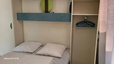 Un ou plusieurs lits dans un hébergement de l'établissement Chalet climatisé avec patio en Haute Corse 5 couchages