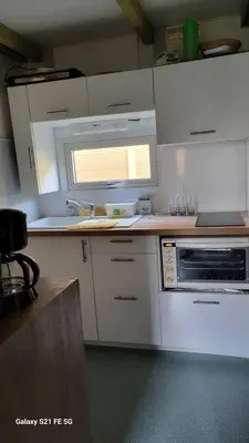 Cuisine ou kitchenette dans l'établissement Chalet climatisé avec patio en Haute Corse 5 couchages