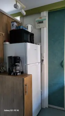 Cuisine ou kitchenette dans l'établissement Chalet climatisé avec patio en Haute Corse 5 couchages