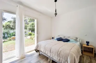Un ou plusieurs lits dans un hébergement de l'établissement Mini Villa Pascal Paoli avec piscine - proche mer