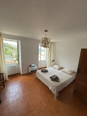 Un ou plusieurs lits dans un hébergement de l'établissement Maison Lama