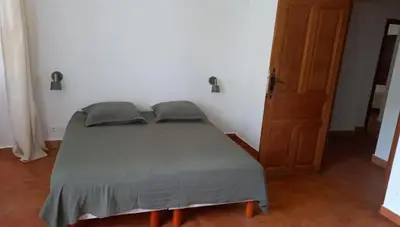 Un ou plusieurs lits dans un hébergement de l'établissement Maison Lama