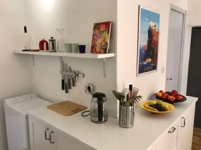 Cuisine ou kitchenette dans l'établissement Charmant T3 Centre ville Corté