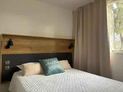 Un ou plusieurs lits dans un hébergement de l'établissement CAMPING MONTE ORTU