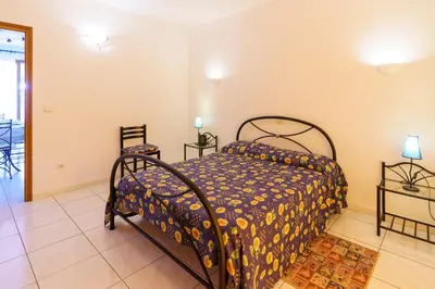 Un ou plusieurs lits dans un hébergement de l'établissement La Caletta Corsa Apartments - 2 Camere con Terrazza Privata, Aria Condizionata, 100m dal Mare
