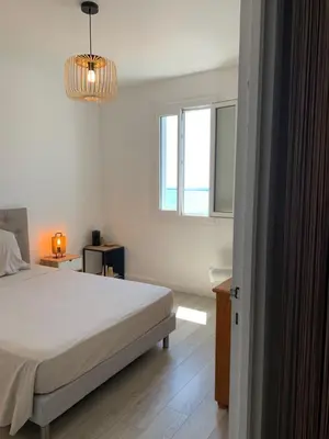 Un ou plusieurs lits dans un hébergement de l'établissement Magnifique maison avec vue mer hauteur de Bastia