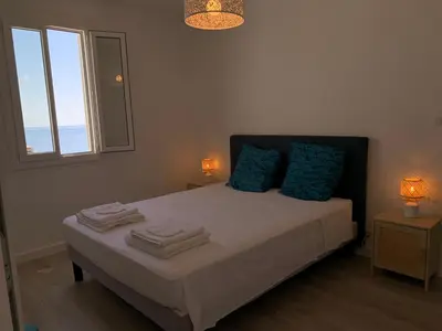 Un ou plusieurs lits dans un hébergement de l'établissement Magnifique maison avec vue mer hauteur de Bastia