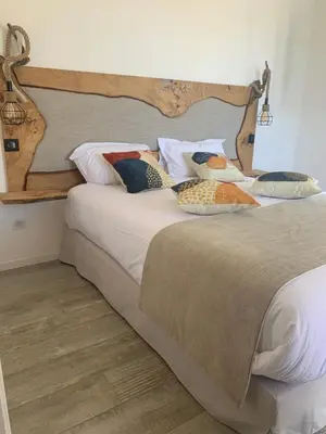 Un ou plusieurs lits dans un hébergement de l'établissement VILLA MACAGNA