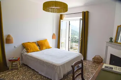 Un ou plusieurs lits dans un hébergement de l'établissement Casa Maestracci - Maison d'hôtes de caractère en Balagne, proche Calvi, entre mer et montagne