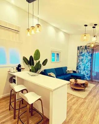 Coin salon dans l'établissement Mini Villa Indépendante à 350m de la mer (LAX)